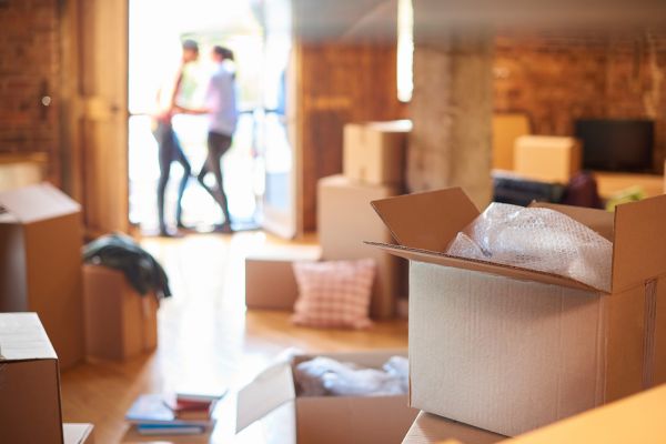 Photo of people moving into a new home - a positive life change that can trigger anxiety